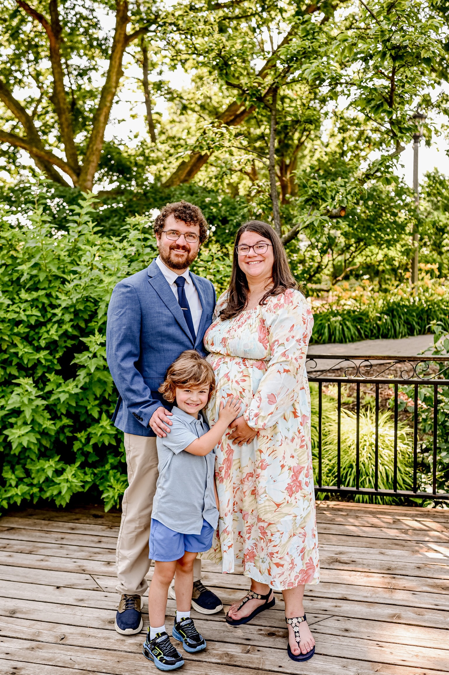 Family at in plant covered arch