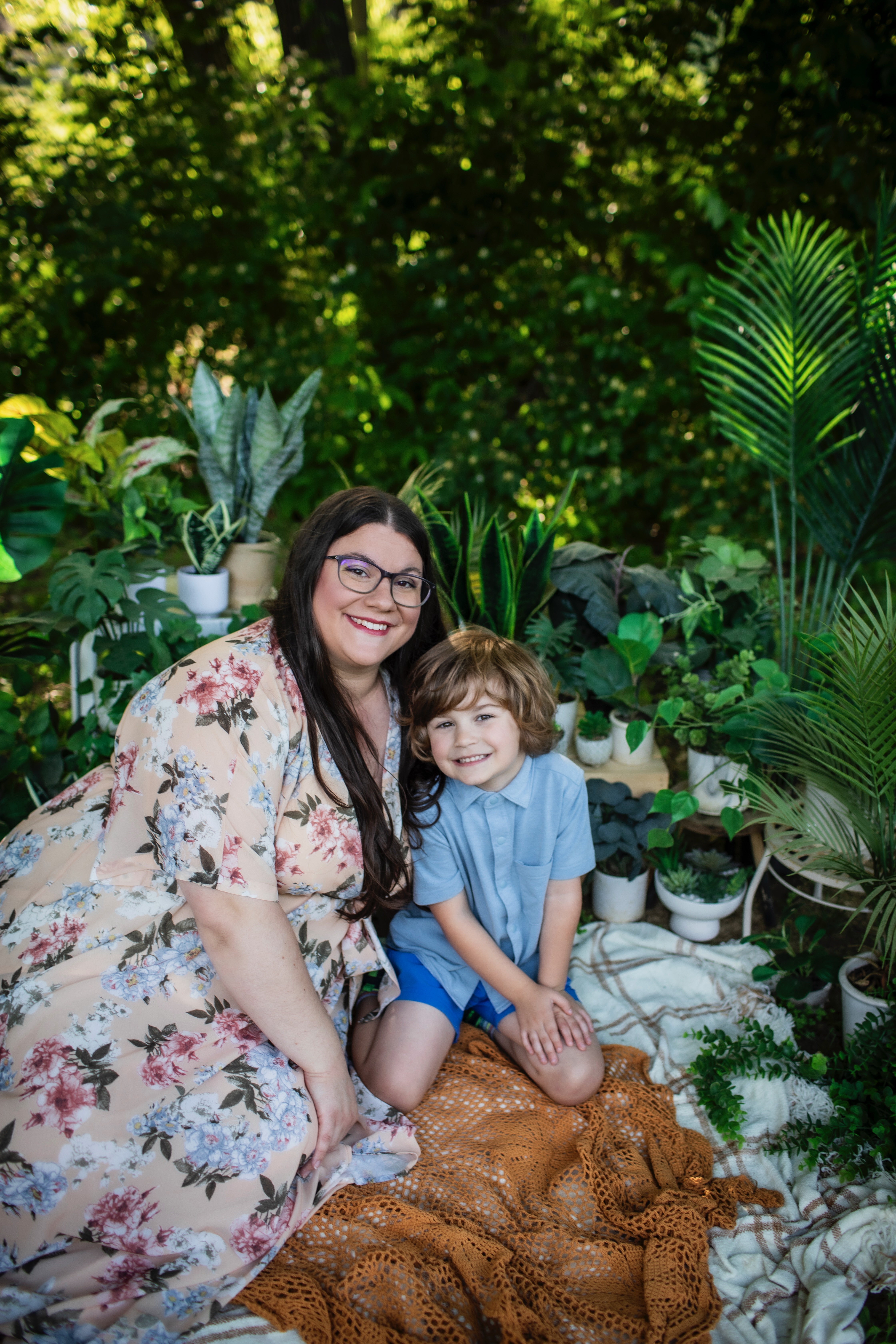 Wife and son surrounded by plants